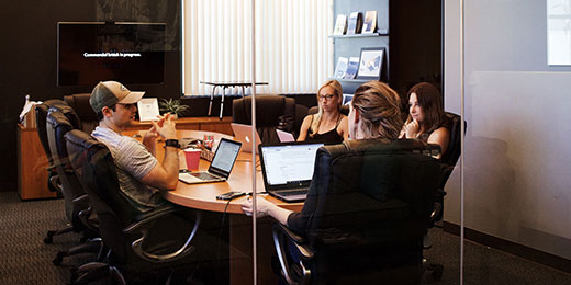Colleagues sat in board room